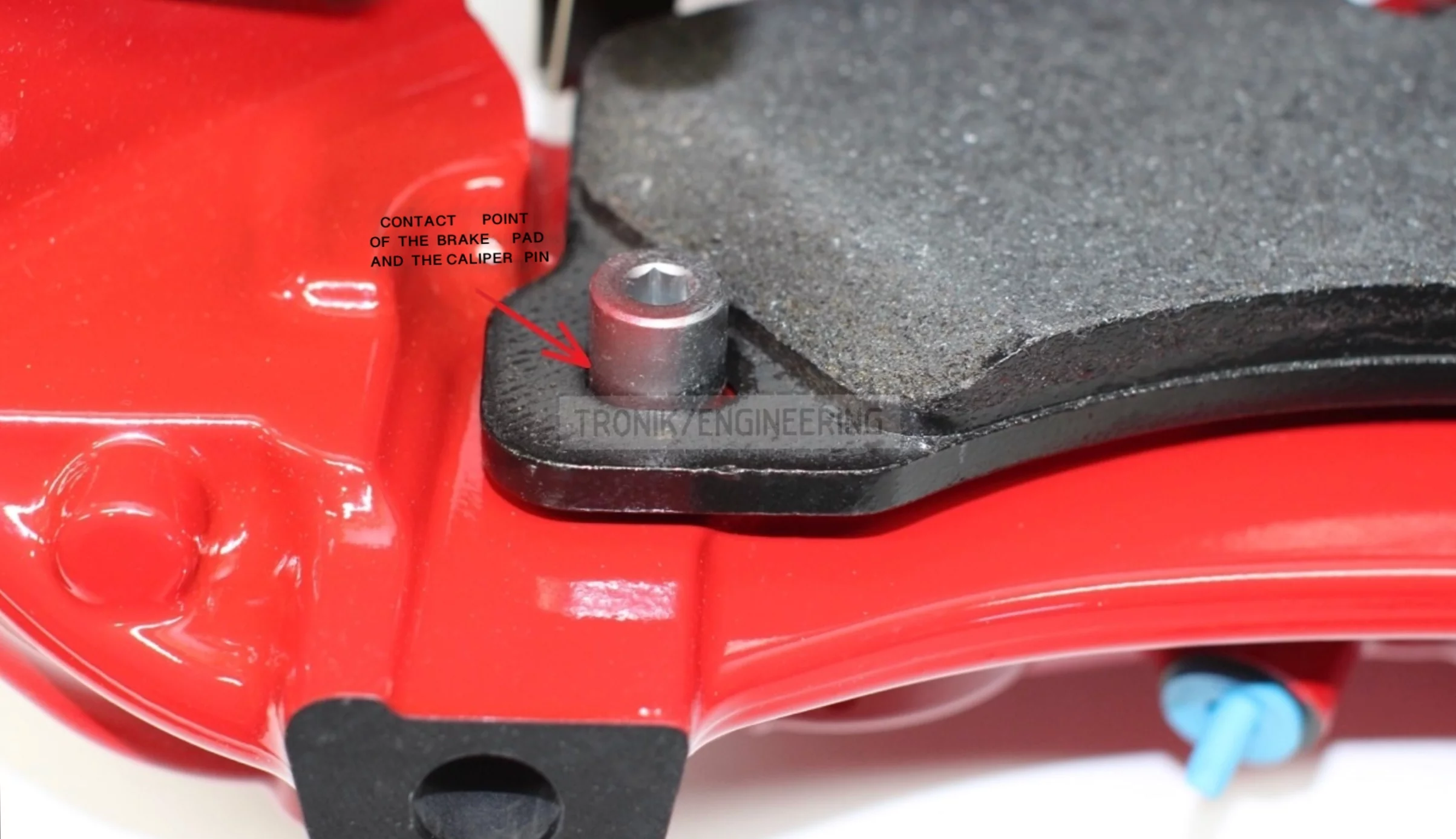 contact point of brake pad and caliper pin