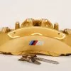 34 11 7 850 464 Gold front right caliper