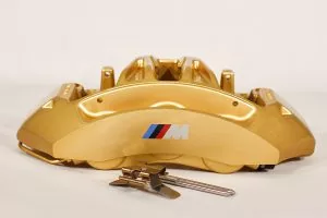 34 11 7 850 464 Gold front right caliper
